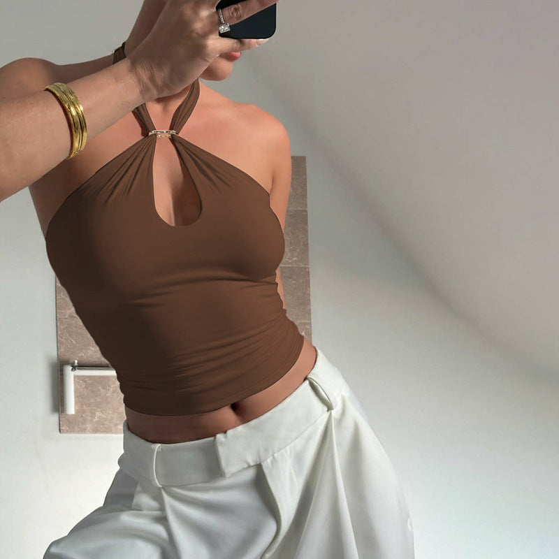 Halter ring crop top photographed in a modern interior setting