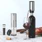 The electric pourer pours aerated red wine into a glass beside the opener, stopper and foil cutter