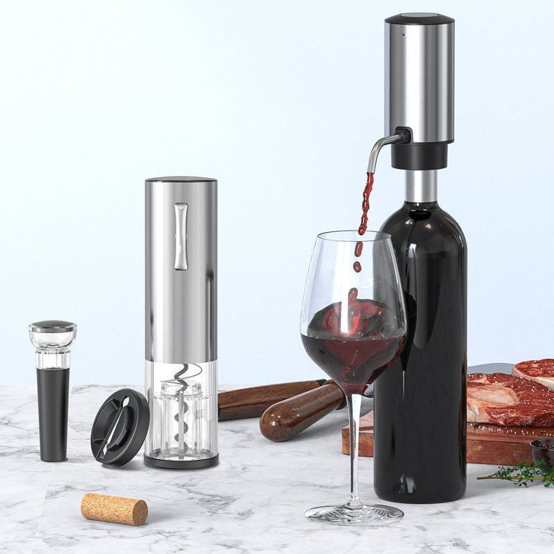 The electric pourer pours aerated red wine into a glass beside the opener, stopper and foil cutter