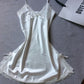 White satin slip nightdress with white lace trim and small bows, flat on a gray cloth, option photo for size M