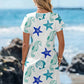 V-neck starfish and seahorse print A-line beach dress, close up of the starfish and seahorse print
