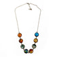 Antique bronze tone solar system necklace laid flat on white, eight celestial cabochons in a row with clasp