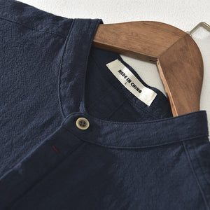 White striped short sleeve stand collar shirt on a model