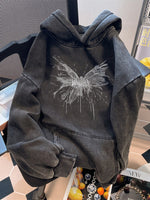Oversize washed vintage black hooded sweatshirt with a faded butterfly front print