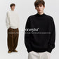 Banner image with two models in plain white and black mock neck sweaters, a different design from this cable knit