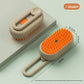 Khaki option: pet spray brush with orange bristles and loop handle, shown with its back and its 19 cm size
