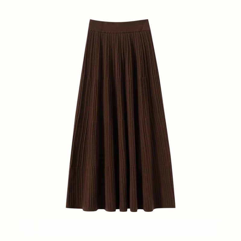 Coffee brown ribbed A-line midi skirt with tiered seams and a wide waistband, flat view on white
