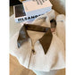 Beige cropped knit cardigan with a glossy brown pointed collar and gold-tone zip, size M option