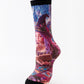 Mid-calf sock on a mannequin printed with a witch with long purple hair reading beside tarot cards