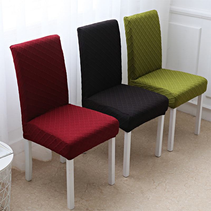 Stretch jacquard dining chair cover with a raised diamond texture on a chair