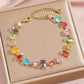 Zircon gold plated leaf bracelet styled on a wrist at a soft angle