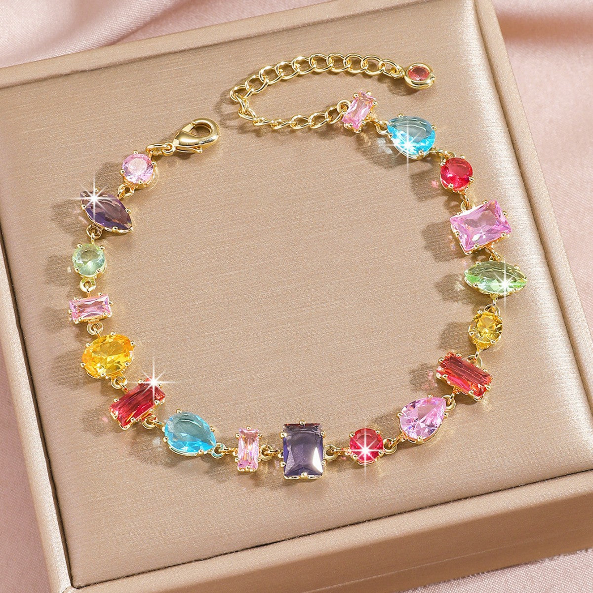 Zircon gold plated leaf bracelet styled on a wrist at a soft angle