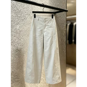 Off white wide leg trousers front view with belt loops and button zip fly