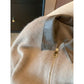 Close-up of a brown knit cardigan with a glossy brown collar and gold-tone zip pull