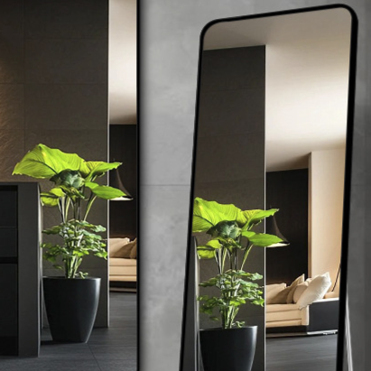 Two framed rectangular mirrors in black showing portrait hanging against a dark wall