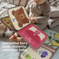 Baby holding the soft sensory cloth book during tummy time play