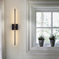 Side profile of the cordless linear wall lamp showing its magnetic square base