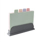 Set of four PP cutting boards in pink green purple and tan with food icon tabs