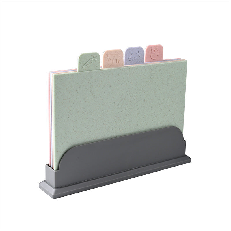 Set of four PP cutting boards in pink green purple and tan with food icon tabs