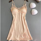 Ice silk lace cami nightgown in nude on a hanger with removable triangle bust pads beside it, hem and lace view
