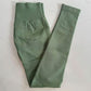 Pistachio green seamless yoga leggings folded flat, showing the tall ribbed waistband