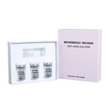 Microneedle serum kit, three 5 ml vials and one applicator cap beside a pink facial version box