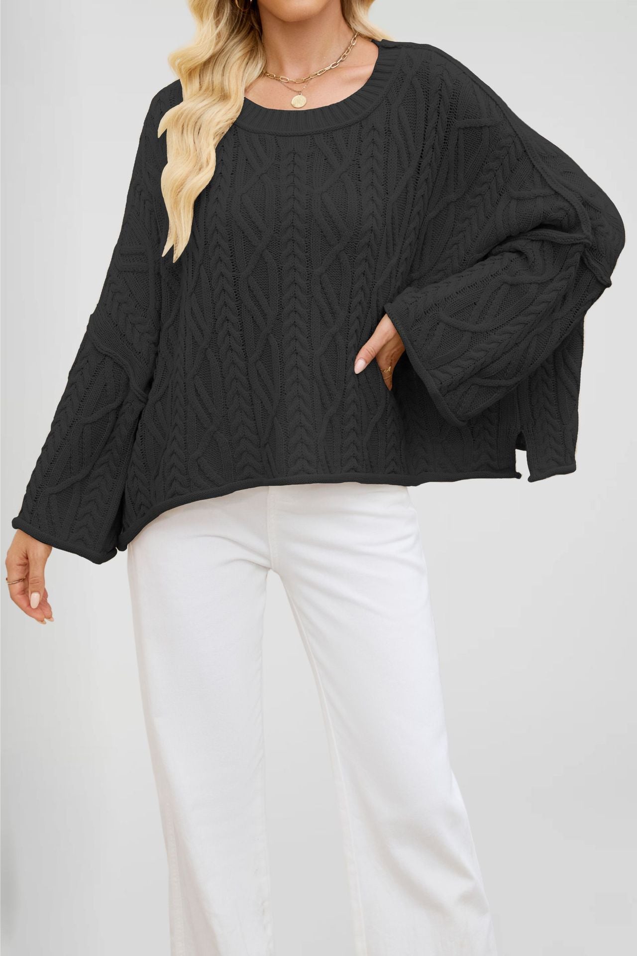 Round neck twist cable pullover shown with a boxy relaxed body and dropped shoulders
