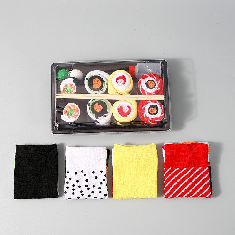 Flat lay of food pattern cotton crew socks in bright colours, sushi and roll designs knit into the cotton