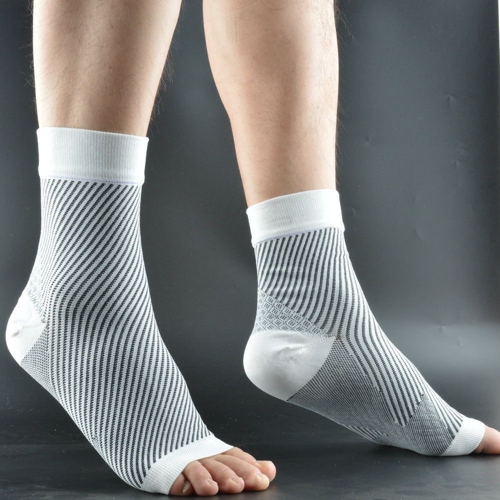White nylon knit compression foot sleeves worn on both feet, side view, open toe and ribbed ankle cuff