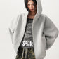 Zip up hooded sweatshirt front view with the full length two way zipper closed to the chest