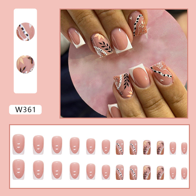 Full cover press-on almond nails in a leaf print, glossy finish shown on a hand