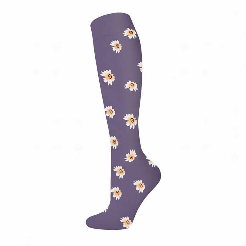 Purple knee-high compression sock with white daisies and yellow centers, size S/M, on a white background