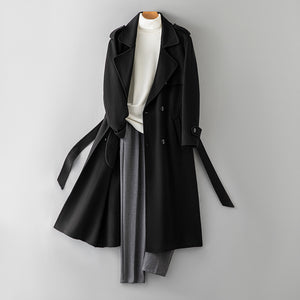 Black double breasted double faced wool overcoat with belt shown on a hanger