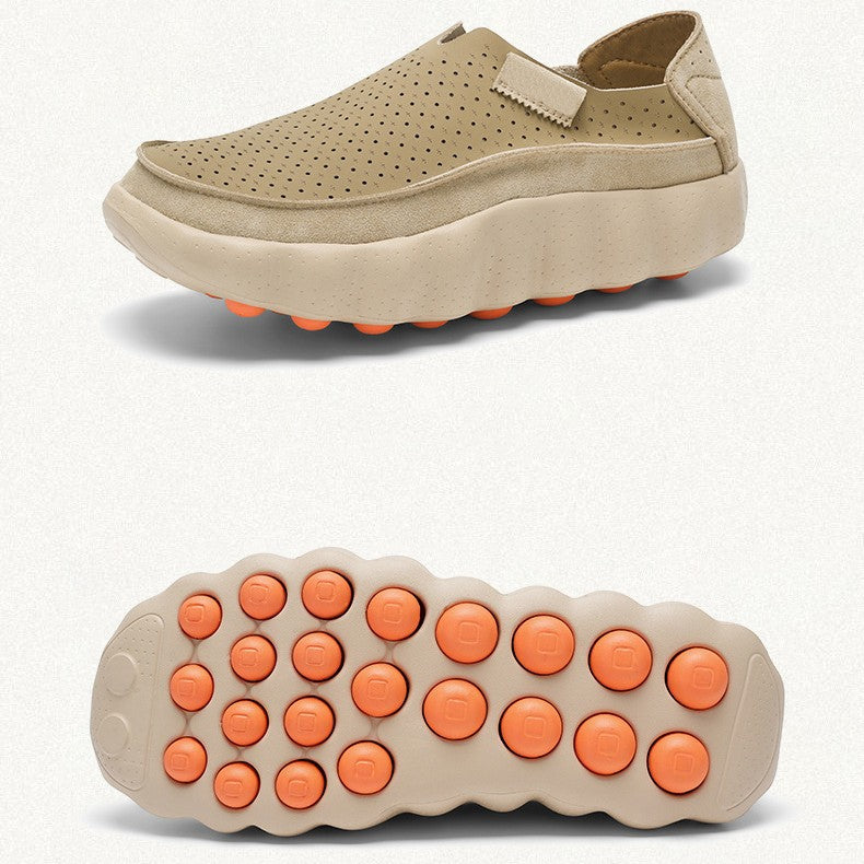 Khaki perforated leather slip-on shoe with thick wavy sole, side view above and orange studded outsole below