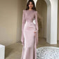 Front view of the slim-fit dress with a close bodice and clean waist seam