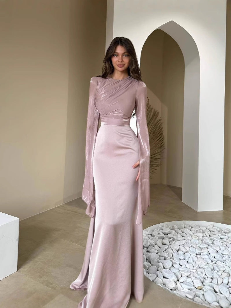 Front view of the slim-fit dress with a close bodice and clean waist seam