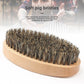 Oval lotus wood beard brush packed with soft boar bristles shown close up