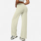 Cream apricot high-waist wide-leg flared yoga pants rear view on a model, white studio