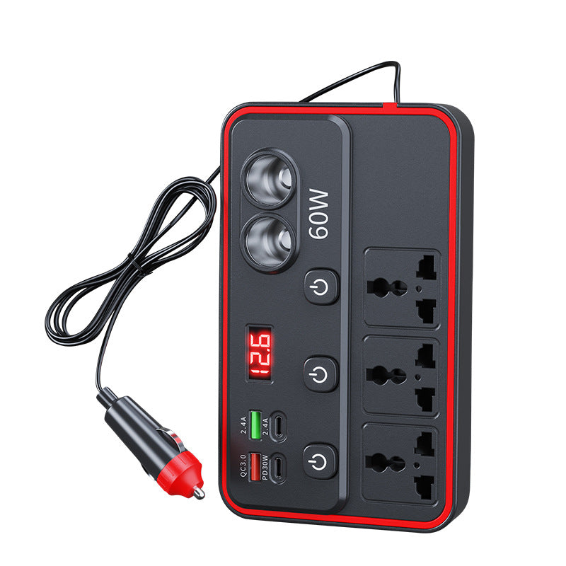 Black and red car power inverter with three AC outlets, two lighter sockets, four USB ports and a display on white