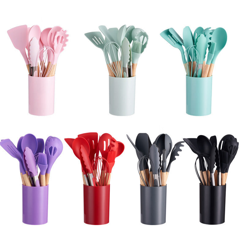 Silicone kitchen utensil set shown in several colours, each set standing in its own matching holder