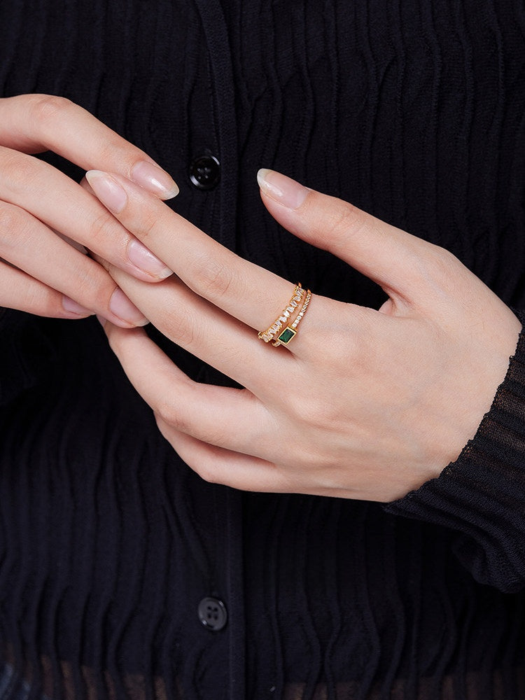 Side profile of the open double-layer ring showing the adjustable back and polished alloy