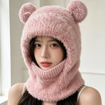 Pink fluffy knit bear ear balaclava hood worn by a woman with a ribbed neck tube