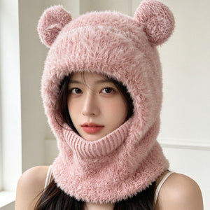 Pink fluffy knit bear ear balaclava hood worn by a woman with a ribbed neck tube