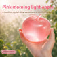 Blue translucent TPR apple squeeze toy catching the light with its moulded stalk and leaf