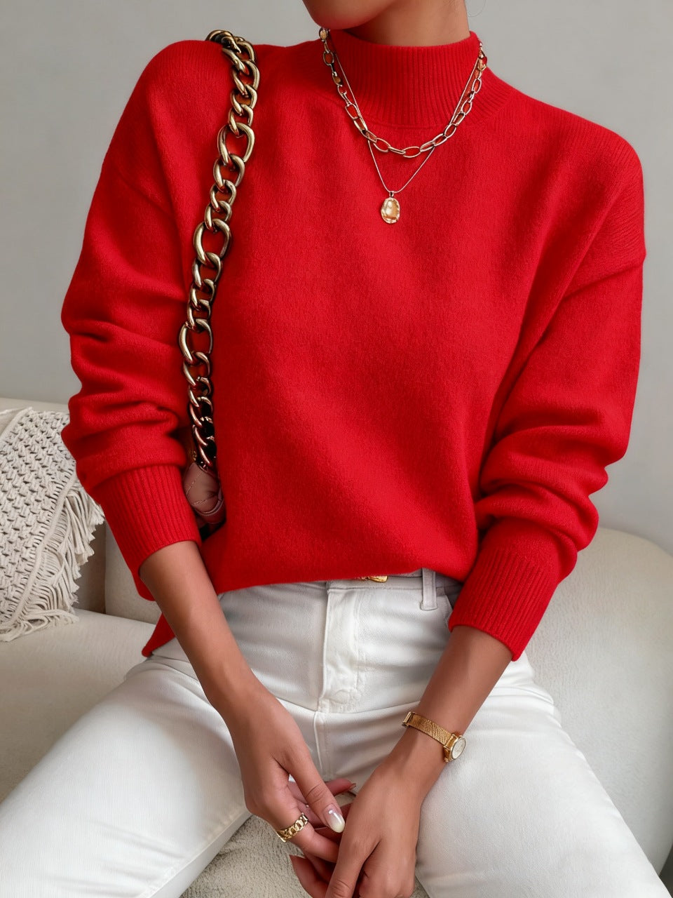 Red half-high neck pullover sweater with long sleeves worn with white trousers, size XL variant image