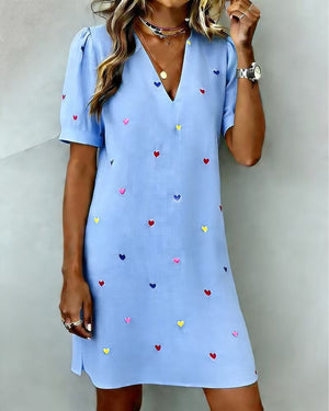 Printed dress side profile showing the drape and defined waistline