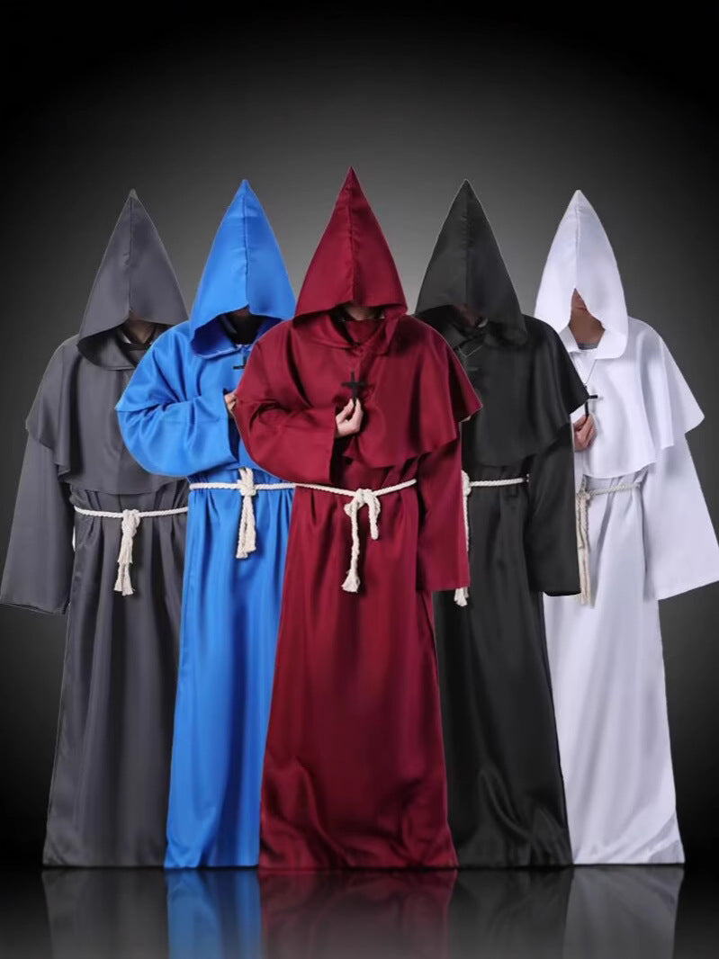 Five hooded monk robes in gray, blue, maroon, black and white standing side by side on a dark studio backdrop