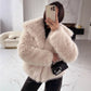 Blush beige vegan fur jacket on a model taking a mirror selfie, option Blush Beige, size M