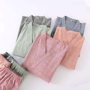 Flat lay of kimono pajama sets in several colors including pink and orange, which are not offered in this listing