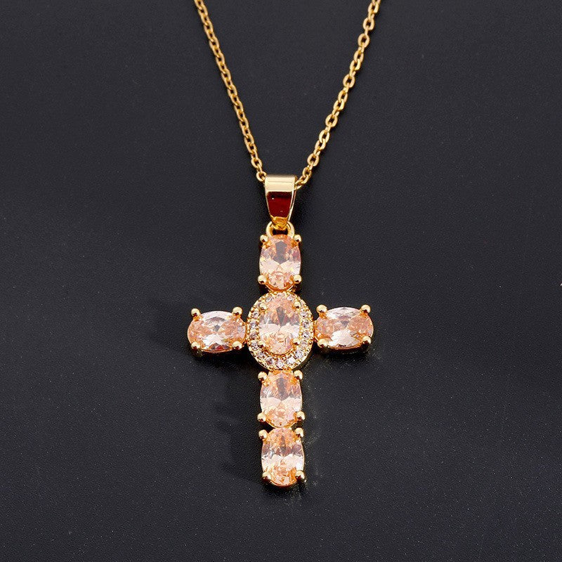 Silver tone cross pendant paved with clear cubic zirconia, close up detail